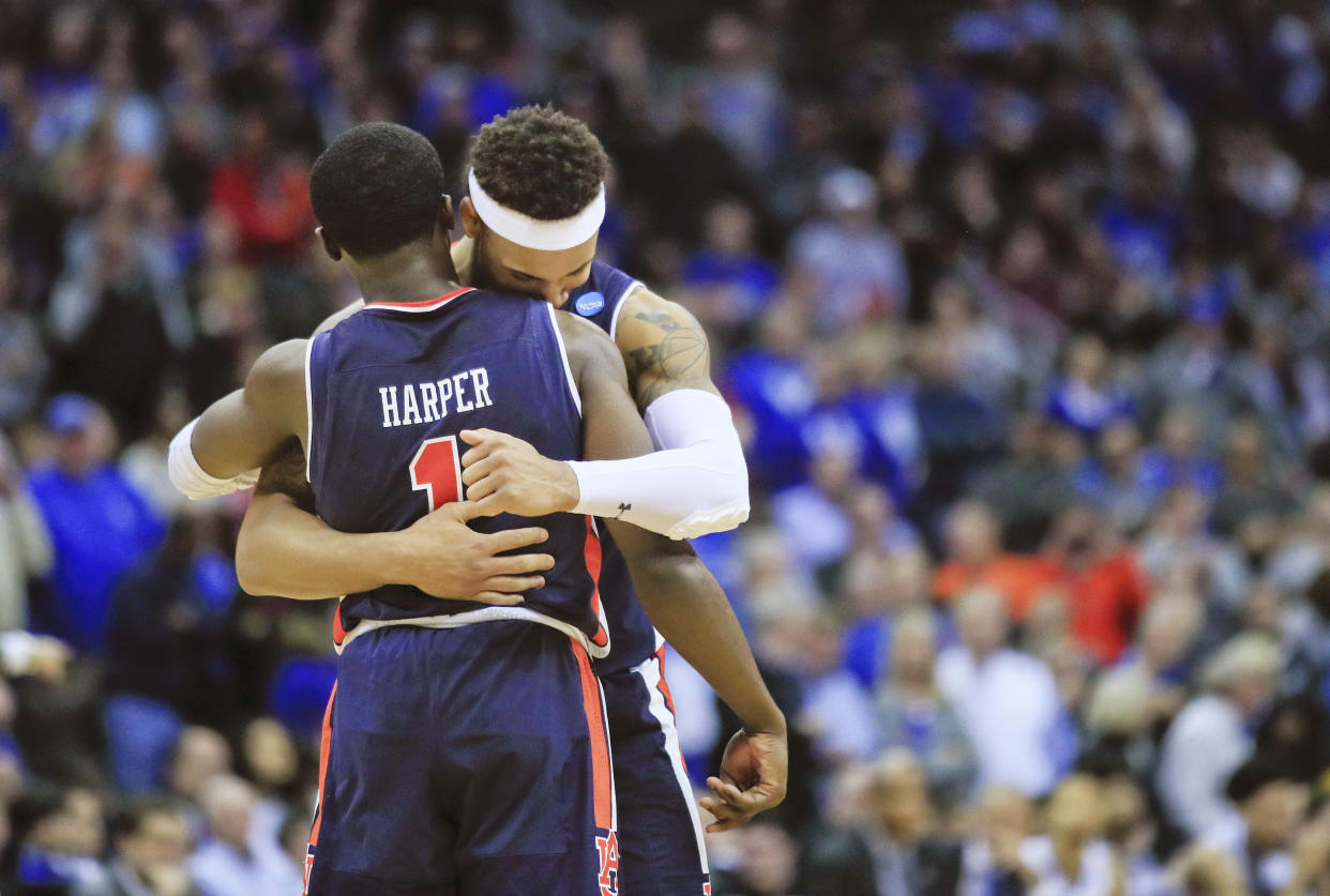 Auburn's Jared Harper (1) and teammate Bryce Brown celebrate near the end of overtime of the Midwest Regional final game against Kentucky in the NCAA men's college basketball tournament Sunday, March 31, 2019, in Kansas City, Mo. Auburn won 77-71 in overtime. (AP Photo/Orlin Wagner)