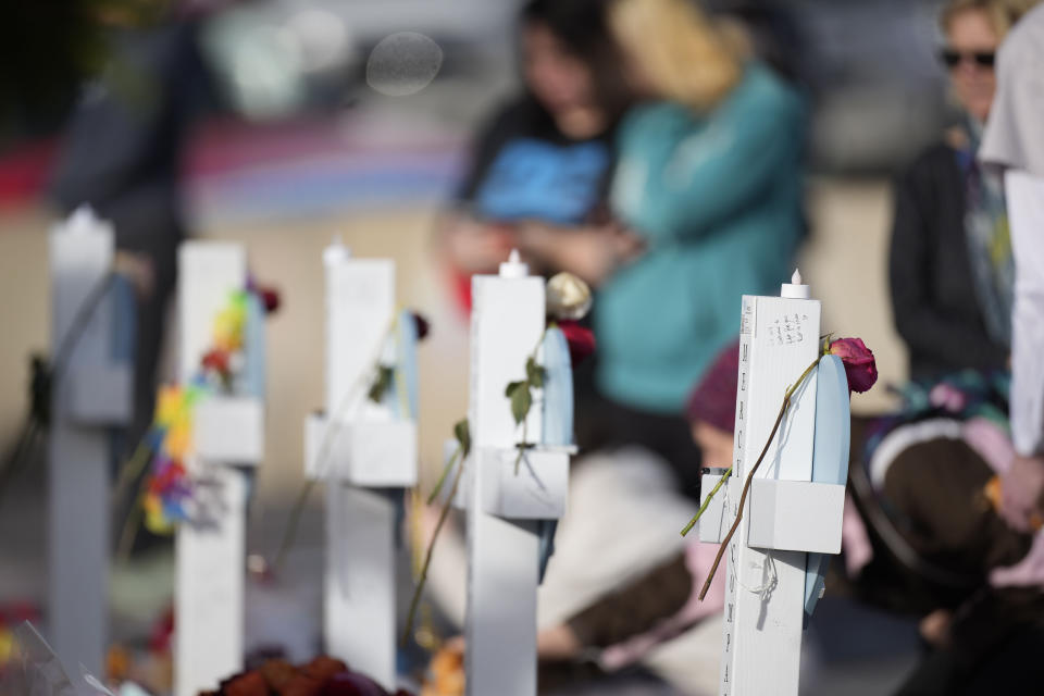 Crosses stand at a makeshift memorial for the victims of a mass shooting over the weekend at a gay nightclub Wednesday, Nov. 23, 2022, in Colorado Springs, Colo. (AP Photo/David Zalubowski)