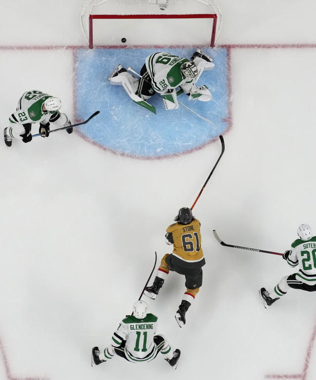 Vegas Golden Knights right wing Mark Stone (61) scores on Dallas Stars goaltender Jake Oettinger (29) during the first period of Game 2 of the NHL hockey Stanley Cup Western Conference finals Sunday, May 21, 2023, in Las Vegas. (AP Photo/John Locher)