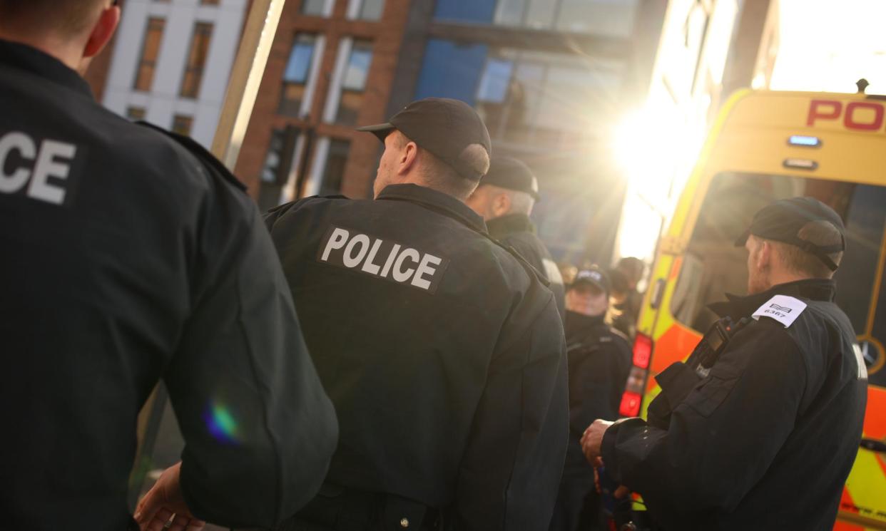 <span>Police in Liverpool before protests on 7 August.</span><span>Photograph: Ryan Jenkinson/Getty Images</span>