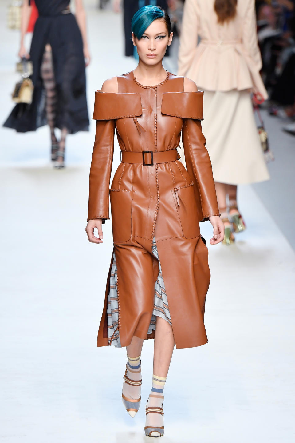 <p>Bella lived out her edgiest teenage dreams with blue side bangs at Fendi.</p>