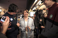 Sen. Amy Klobuchar, D-Minn., center, does a meet-and-greet before speaking at a campaign stop at The Village Trestle in Goffstown, N.H., Monday, Feb. 18, 2019. (AP Photo/Cheryl Senter)