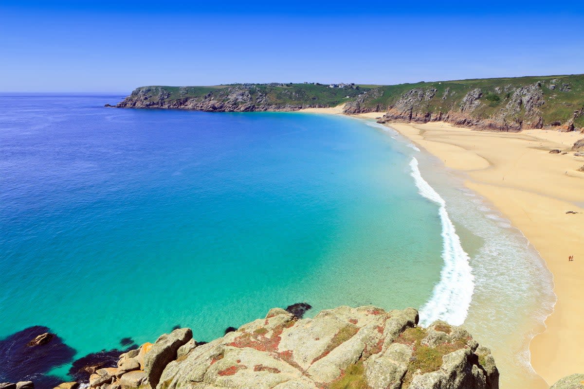 Pop a parasol on Porthcurno’s white sands (Getty Images/iStockphoto)