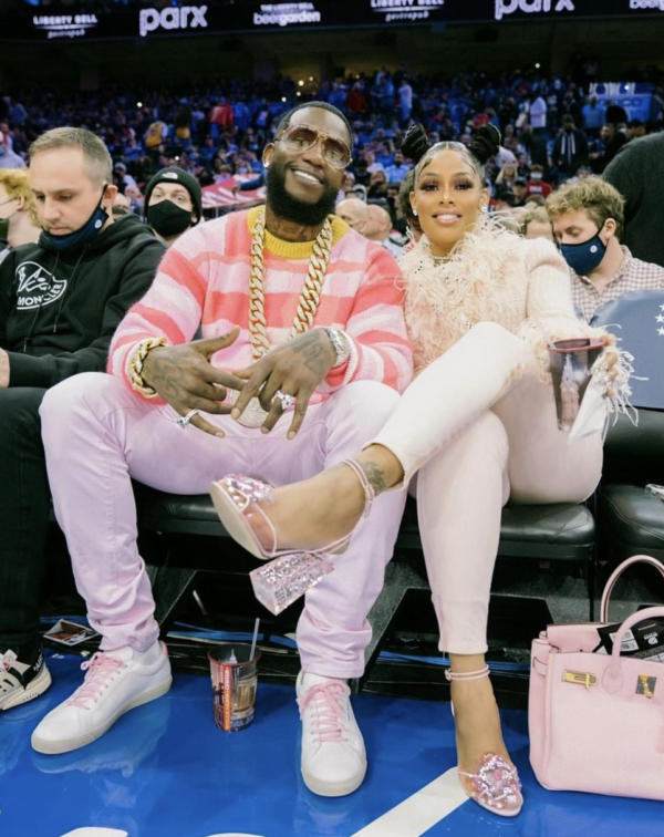 Rapper Gucci Mane, left, and his wife, Keyshia Ka'Oir, sit courtside during  the NBA All-Star Saturday Night festivities at Spectrum Center in  Charlotte, N.C., on Saturday, Feb. 16, 2019. (Photo by Jeff