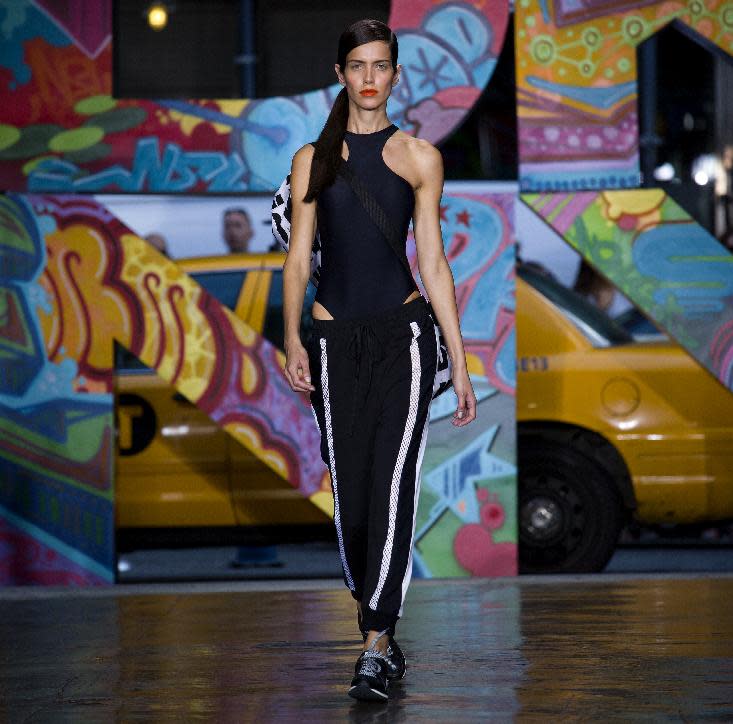 The DKNY Spring 2014 collection is modeled during Fashion Week in New York, Sunday, Sept. 8, 2013. (AP Photo/Craig Ruttle)