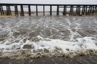 Water flows in the Mojave River after rain soaked Hesperia CA on Thursday January 17, 2019. The Mojave River flows under ground the majority of the year. (James Quigg/The Daily Press via AP)