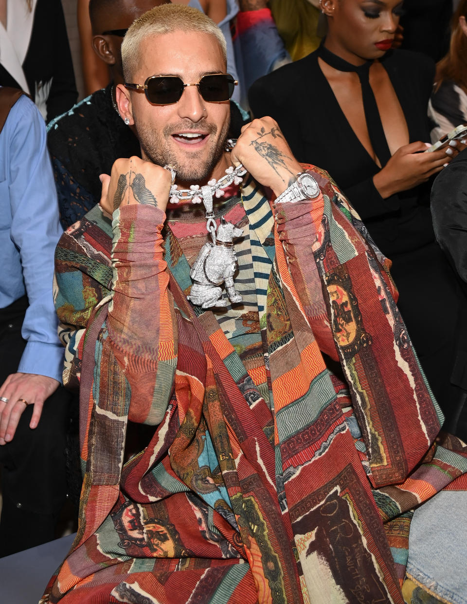 <p>Maluma shows off his unique jewelry on July 6 during the Jean-Paul Gaultier fashion show at Paris Fashion Week. </p>