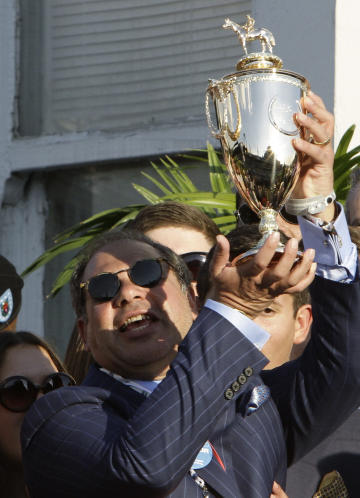 American Pharoah owner Ahmed Zayat celebrates his first Kentucky Derby victory. (AP)