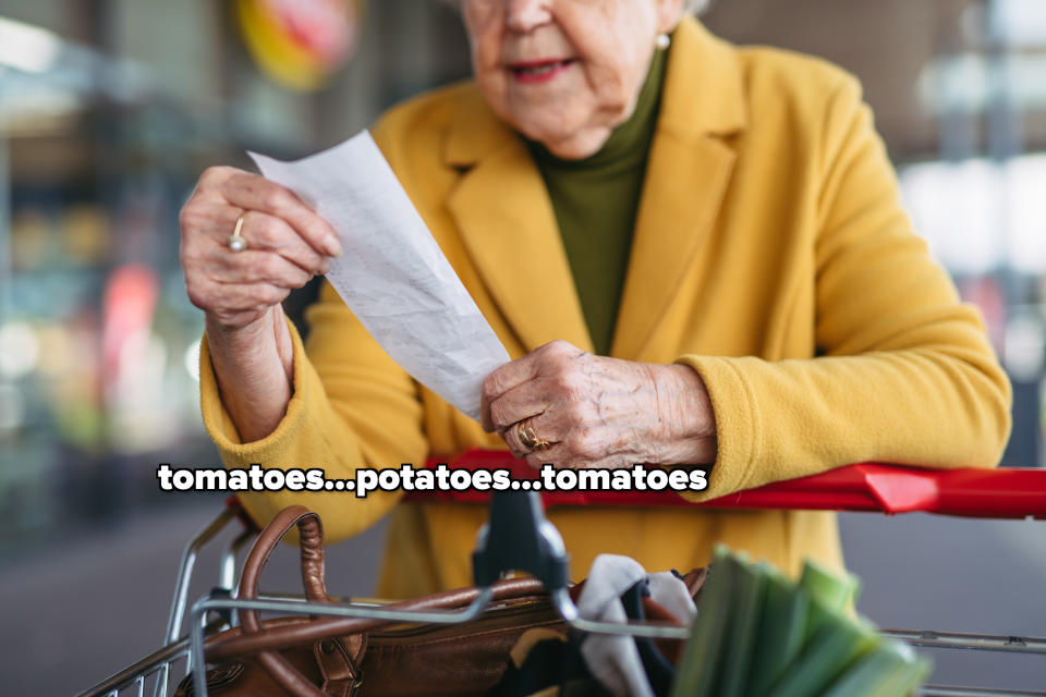 A woman looking at a receipt