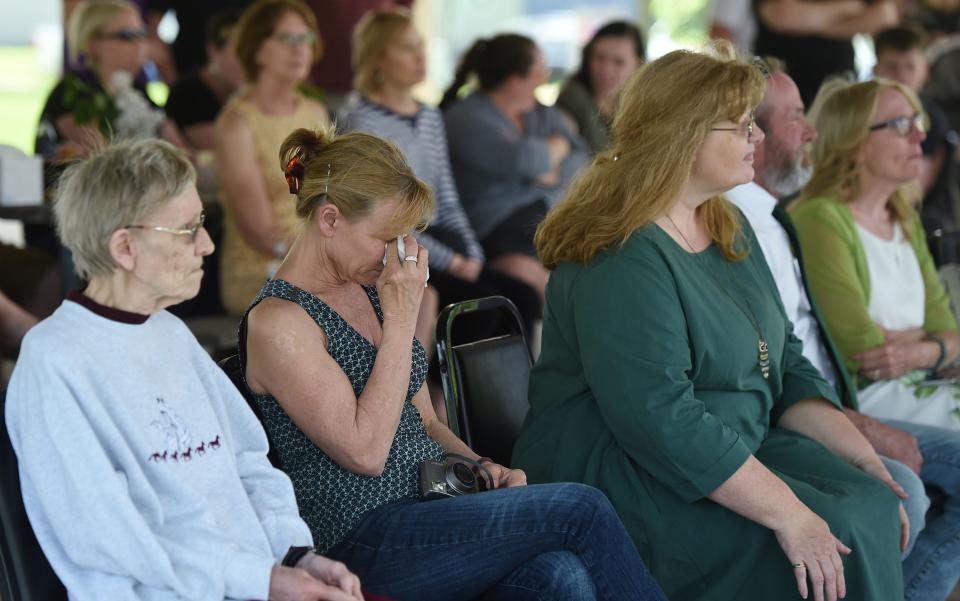 Family members of Jessica Hiatt grieve during her celebration of life service at Nelson Park in Slater, Iowa, on Monday, May 16, 2022.