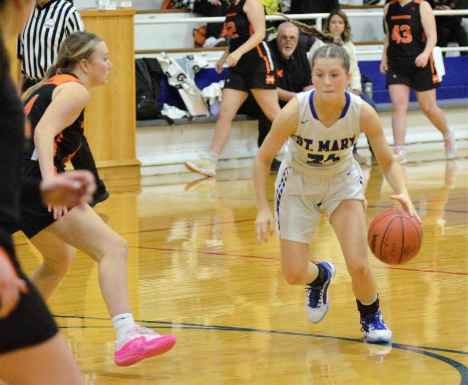 Kaylee Jeffers drives during a Ski Valley girls basketball matchup between Gaylord St. Mary and Mancelona on Friday, Jan. 5.