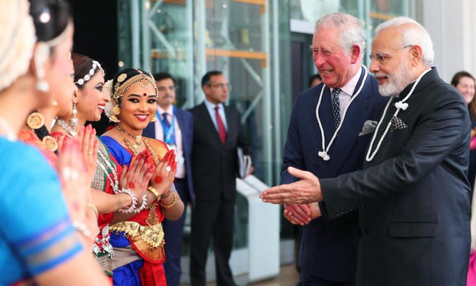 Prince Charles and the prime minister of India, Narendra Modi, speak to dancers during their visit to the Science Museum.