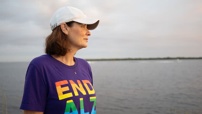 Michele Hall, 55, of Bradenton, Fla., looks at her walking companions at the De Soto National Memorial on Sunday, Sept. 25, 2022. Hall was diagnosed with Alzheimer’s disease when she was 53. “I can’t read or write or any of that stuff. But I can talk.”