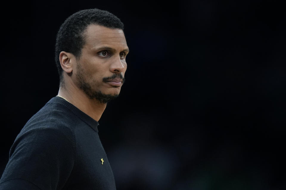 Boston Celtics head coach Joe Mazzulla watches from the bench in the first half of Game 1 of an NBA basketball first-round playoff series against the Miami Heat, Sunday, April 21, 2024, in Boston. (AP Photo/Steven Senne)