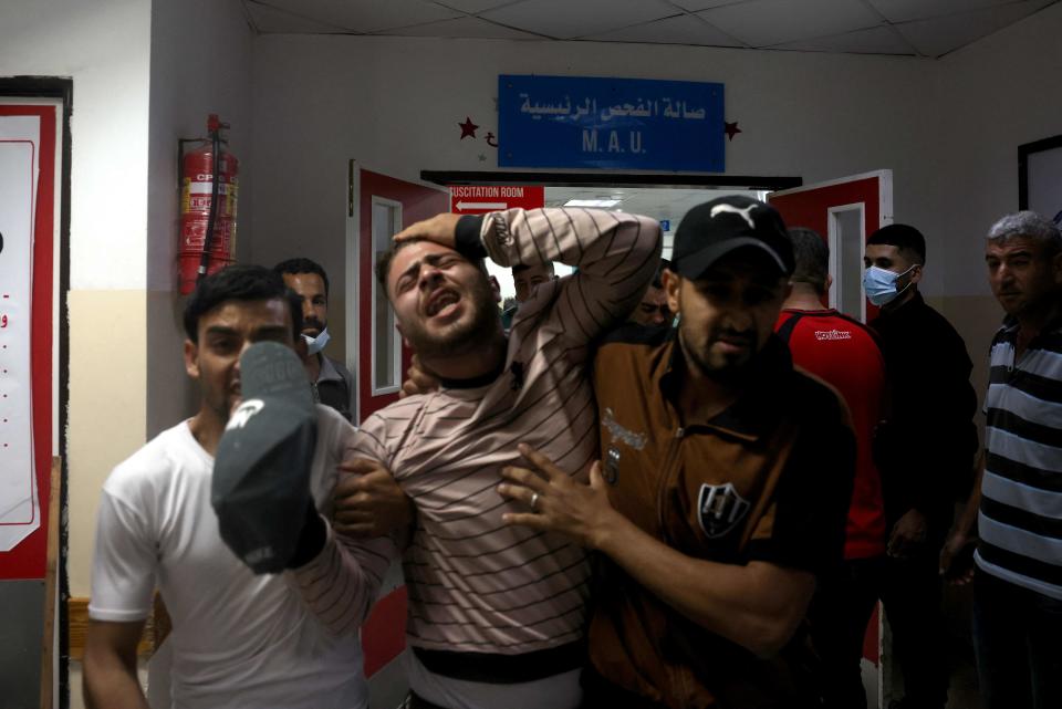 <p>Some 20 people have died following a day of violence in Jerusalem. Pictured: a man in hospital on the northern Gaza strip</p> (AFP)