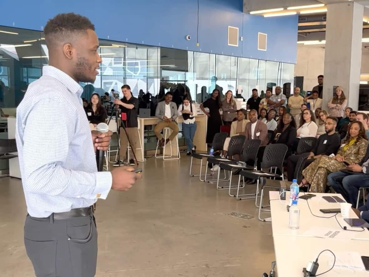 Emmanuel Akindele had three minutes to pitch his business for chance to win  $20,000 in funding in a contest at the DMZ, a tech company incubator at Toronto Metropolitan University. The April contest was part of the school's Black Innovation Programs.   (James Dunne/CBC - image credit)