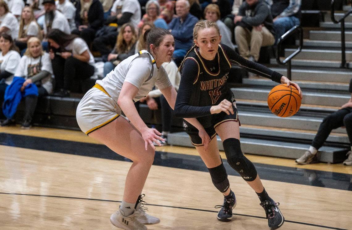 Whitney High School’s Harper Peterson, right, drives past Del Oro’s Sidney Somer in a game Friday, Feb. 2, 2024, at Del Oro High School in Loomis.