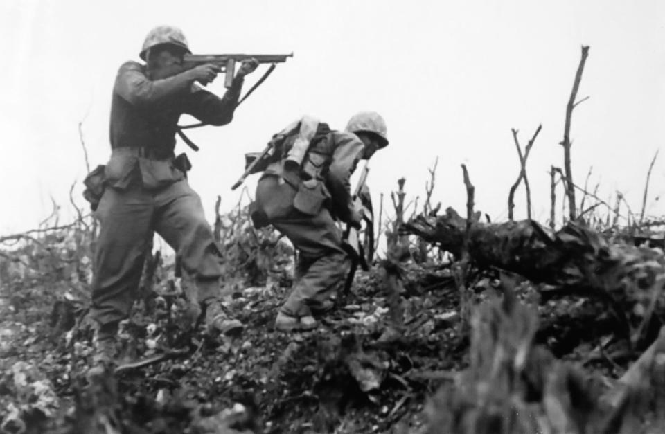 George Mason (left), photographed in Cape Gloucester, New Britain, where the Allied Forces fought Japan during World War II from Dec. 26, 1943, to Jan. 16, 1944.