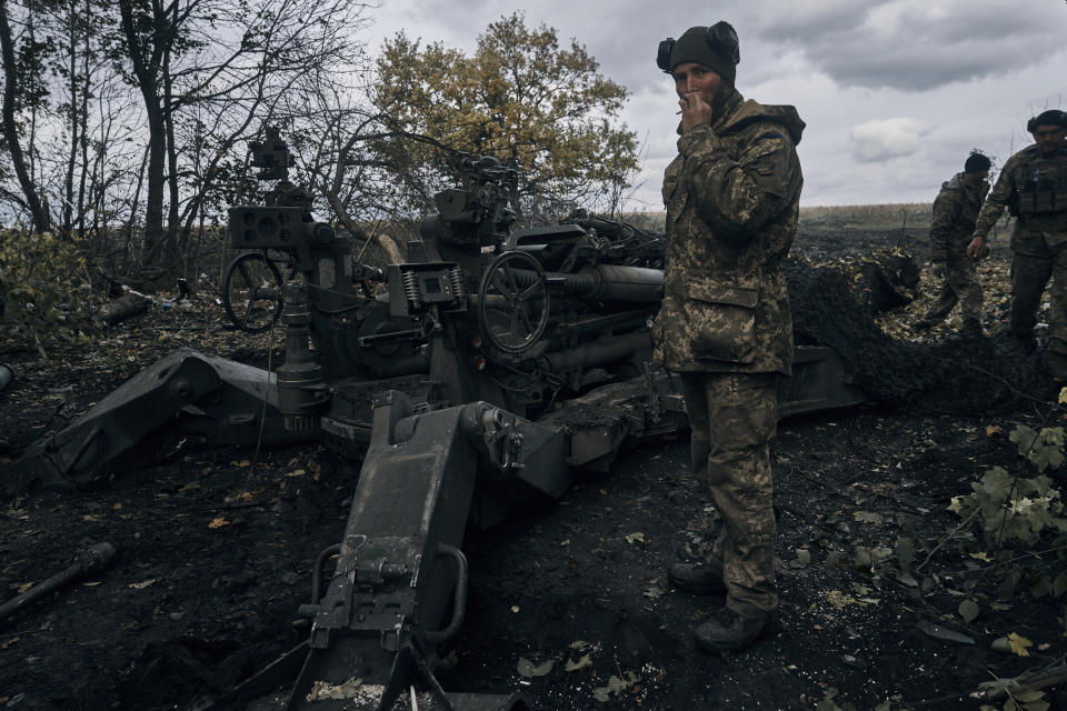 Ukrainian soldiers fire at Russian positions from a U.S.-supplied M777 howitzer in Ukraine's eastern Donetsk region Sunday, Oct. 23, 2022. (AP Photo/LIBKOS)