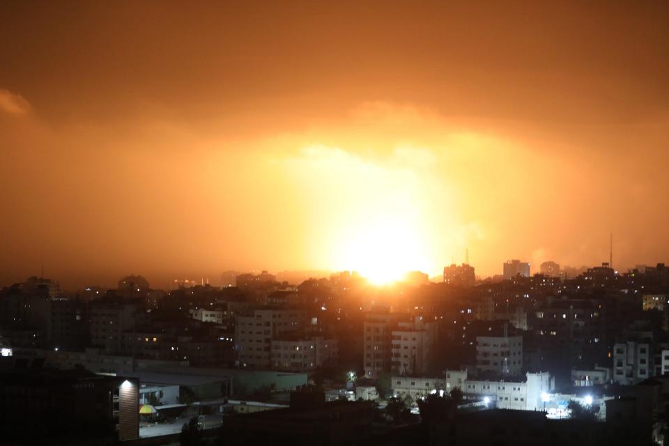Fire billow from Israeli air strikes in Gaza City, Gaza.