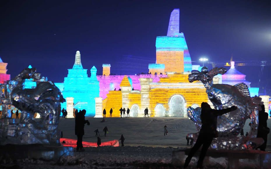 <p>Animal forms being carved out of ice at the festival.</p>