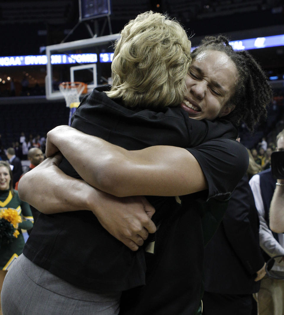 FILE - Baylor's Brittney Griner, right, picks up head coach Kim Mulkey after Baylor beat Duke 51-48 in the NCAA Memphis Regional championship college basketball game Monday, March 29, 2010, in Memphis, Tenn. Griner had for years been known to fans of women's basketball, college player of the year, a two-time Olympic gold medalist and WNBA all-star who dominated her sport. But her arrest on drug-related charges at a Moscow airport in February elevated her profile in ways neither she nor her supporters would have ever hoped for, making her by far the most high-profile American to be jailed abroad. (AP Photo/Mark Humphrey, File)