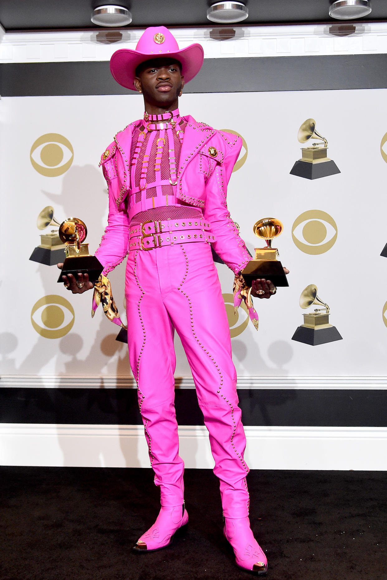Lil Nas X at the 2020 Grammy Awards in a pink look by Versace. - Credit: Getty Images for The Recording A