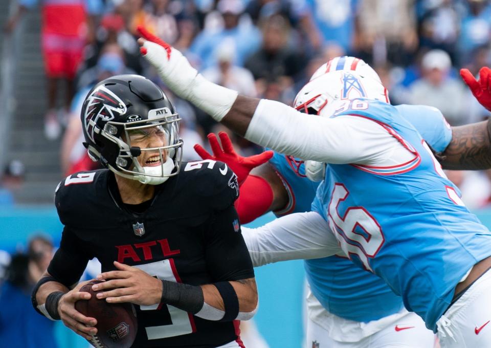 Tennessee Titans defensive end Denico Autry (96) and defensive tackle Jeffery Simmons (98) converge on Atlanta Falcons quarterback Desmond Ridder (9) for a sack in the second quarter at Nissan Stadium in Nashville, Tenn., Sunday, Oct. 29, 2023.