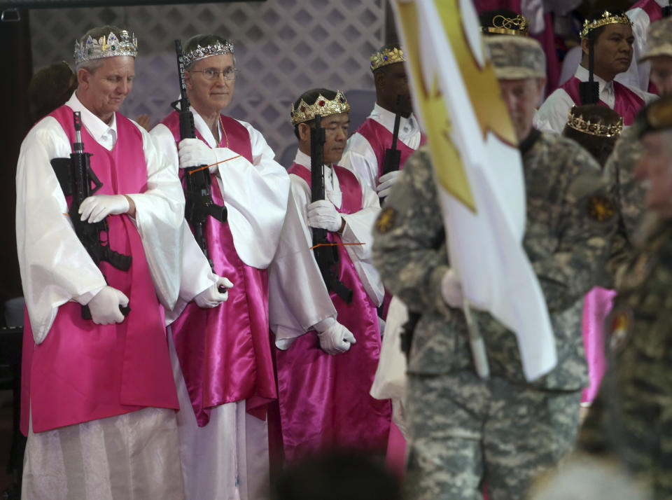 <p>Men wear crowns and hold unloaded weapons at the World Peace and Unification Sanctuary, Wednesday Feb. 28, 2018 in Newfoundland, Pa. (Photo: Jacqueline Larma/AP) </p>