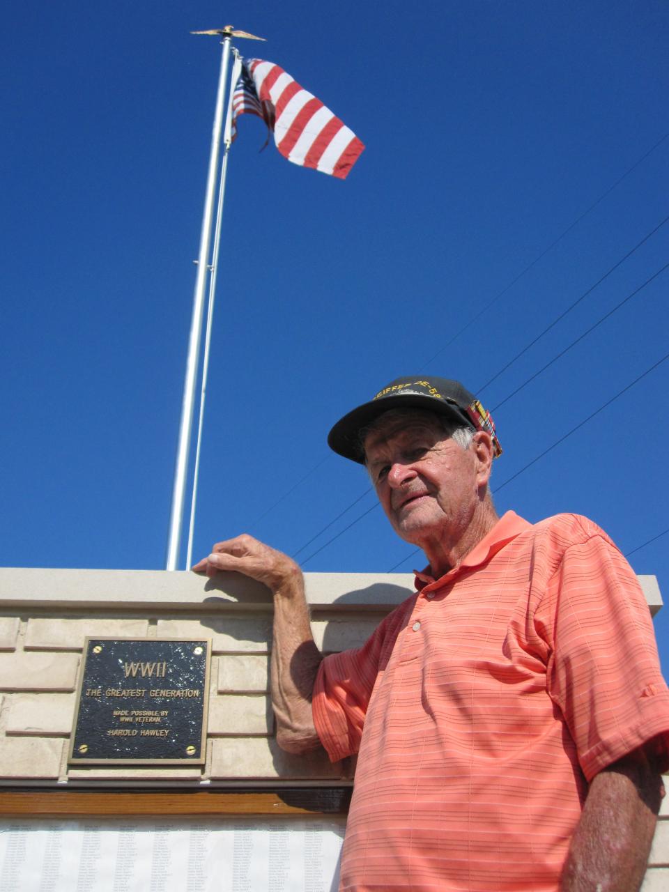 In this photo from 2010, Harold Hawley stands alongside the Winchester monument that he created, honoring Randolph County's 2,800 veterans of World War ll.