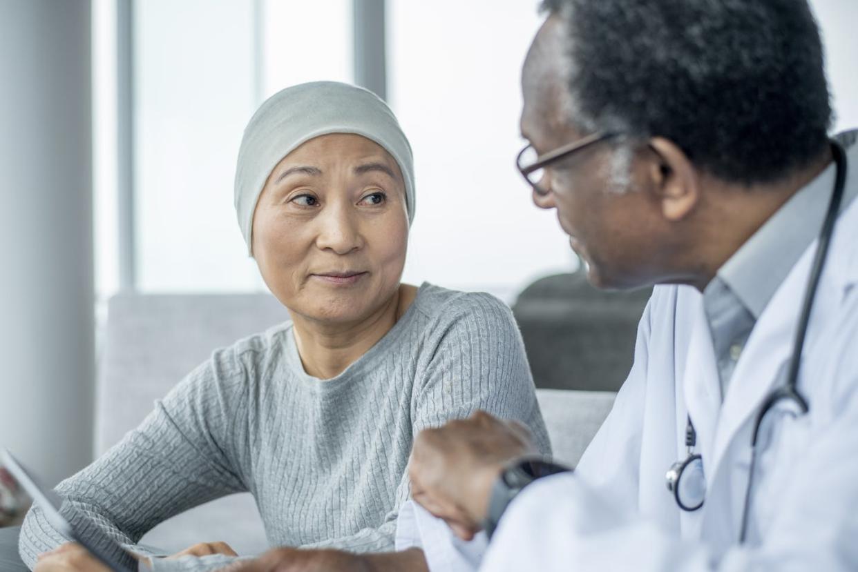 <span class="caption">Communication about cancer works best when the patient is invited to express fears and concerns.</span> <span class="attribution"><a class="link " href="https://www.gettyimages.com/detail/photo/asian-woman-with-cancer-at-doctor-appointment-royalty-free-image/1219588379?adppopup=true" rel="nofollow noopener" target="_blank" data-ylk="slk:FatCamera via Getty Images;elm:context_link;itc:0;sec:content-canvas">FatCamera via Getty Images</a></span>