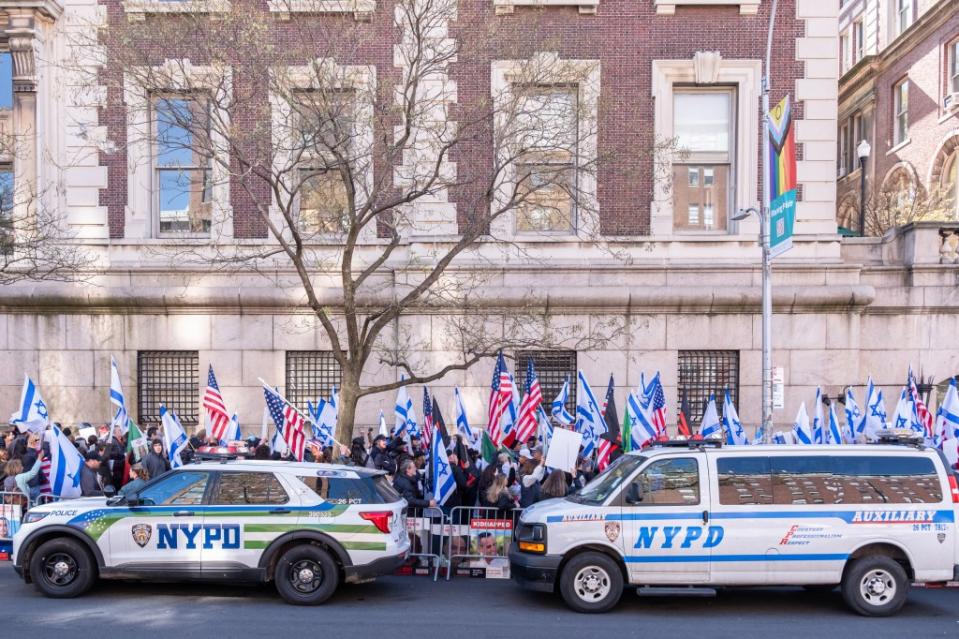 The NYPD looked on while several hundred protesters occupied the sidewalk. DANIEL WILLIAM MCKNIGHT