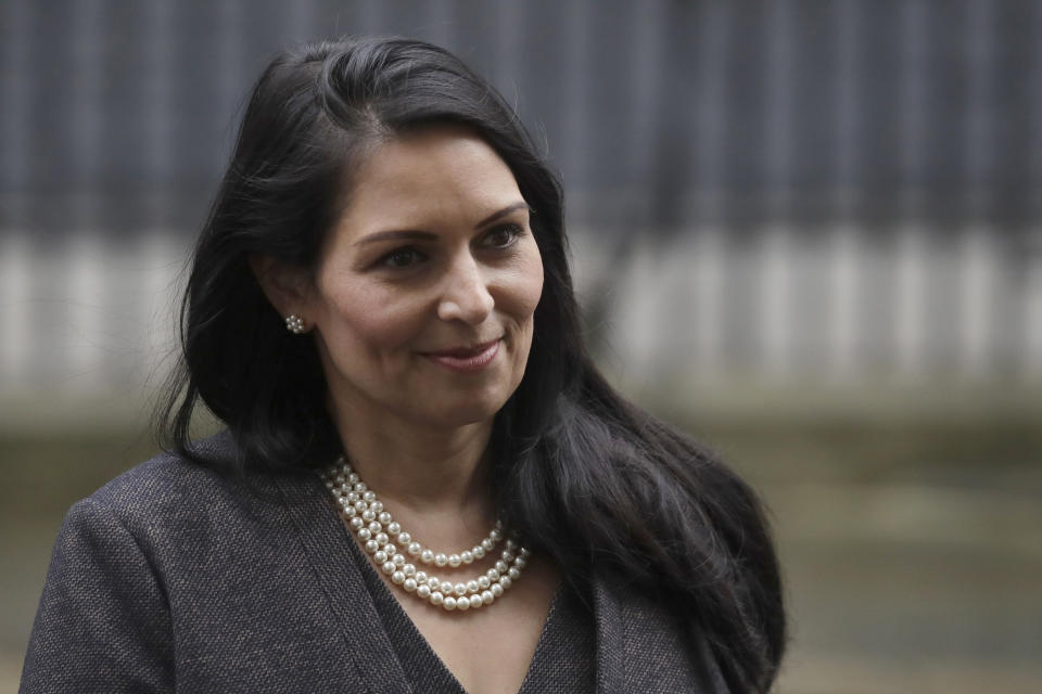 FILE - In this file dated Thursday, Feb. 13, 2020, British Lawmaker Priti Patel, the Home Secretary leaves 10 Downing Street in London. Britain has announced Wednesday Feb. 19, 2020, new post-Brexit “points-based immigration system” said Patel, that will assess prospective immigrants on a range of skills, qualifications, salaries or professions, starting next year. (AP Photo/Matt Dunham, FILE)