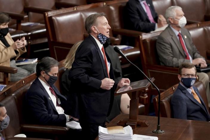 Rep. Paul Gosar, R-Ariz., objects to Arizona&#39;s Electoral College certification from the 2020 presidential election as a joint session of the House and Senate convenes to confirm the Electoral College votes cast in November&#39;s election, at the Capitol in Washington, Wednesday, Jan. 6, 2021. (Greg Nash/Pool via AP)