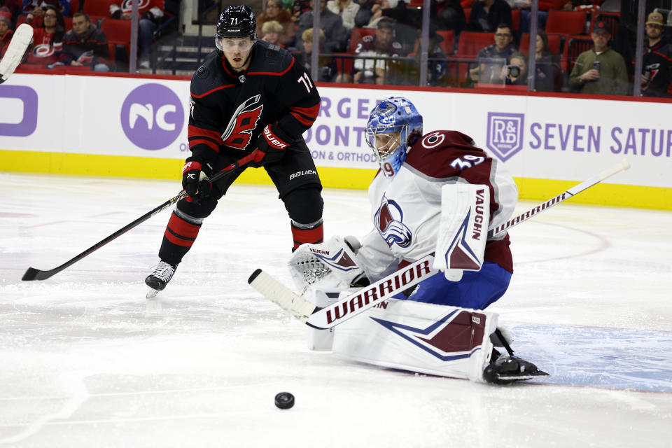 Carolina Hurricanes' Jesper Fast (71) has his shot bounce off Colorado Avalanche goaltender Pavel Francouz (39) during the second period of an NHL hockey game in Raleigh, N.C., Thursday, Nov. 17, 2022. (AP Photo/Karl B DeBlaker)