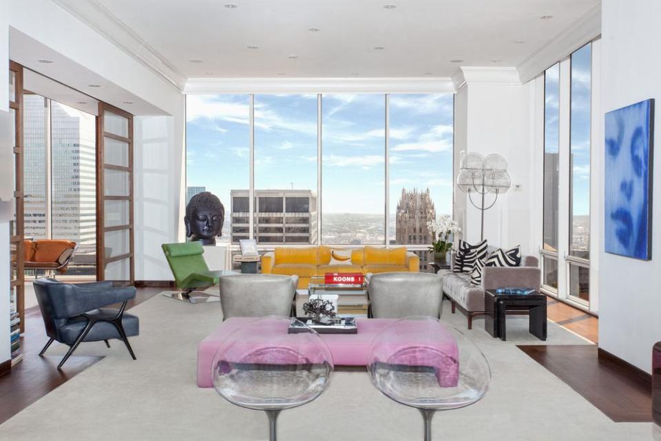 <p>The two-storey unit boasts 14-foot floor-to-ceiling walls with dramatic views of the city and river. (Corcoran) </p>