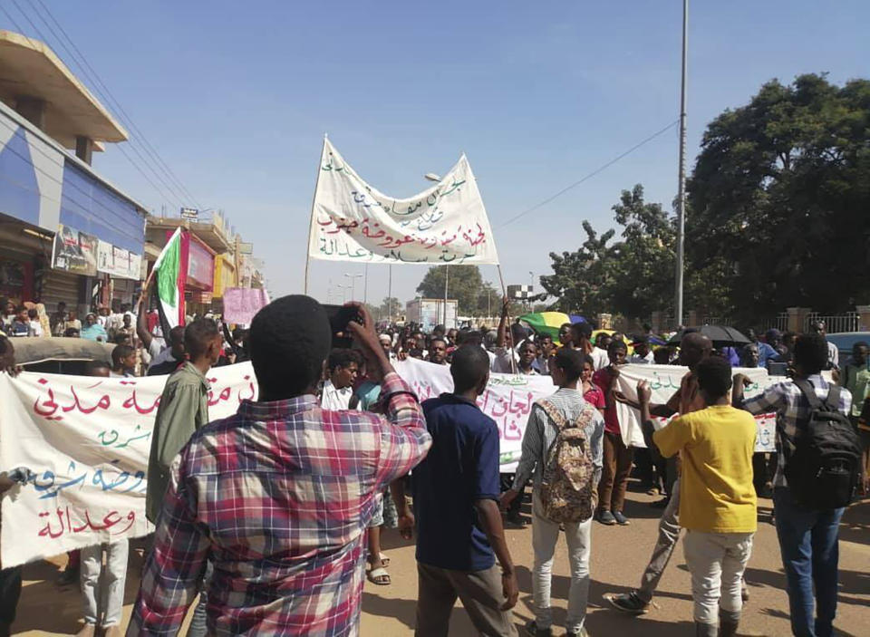 Protesters march in Wad Madani, the provincial capital of al-Jazirah province, Sudan, Sunday, Nov. 3, 2019. Hundreds of protesters took to the streets in Sudan's capital and across the country on Sunday, demanding the disbanding of the former ruling party that underpinned Sudanese President Omar al-Bashir's three decades in power. (The Madani’s Resistance Committee via AP)