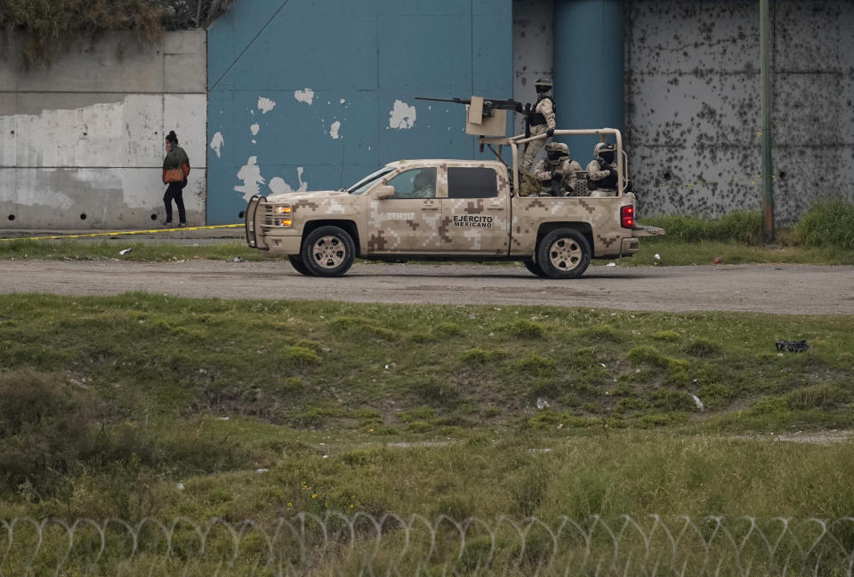 Mexican police patrol along the Rio Grande in Piedras Negras, Mexico, as seen Thursday, Jan. 4, 2024, from Eagle Pass, Texas. According to U.S. officials, a Mexican enforcement surge has contributed to a sharp drop in illegal entries to the U.S. in recent weeks. (AP Photo/Eric Gay)