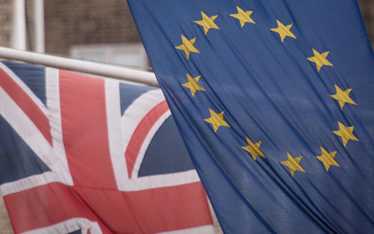 EU flag and union flag - Britain not ready for full border controls on EU imports until six months after Brexit transition period, Government admits - PA