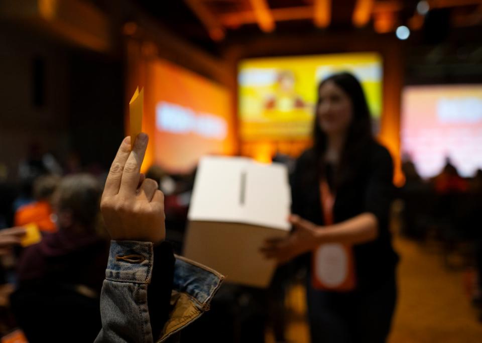 Delegates at the NDP Convention in Hamilton, Ont. cast their ballots in a vote to hold a leadership review or not, on Saturday, October 14, 2023.  