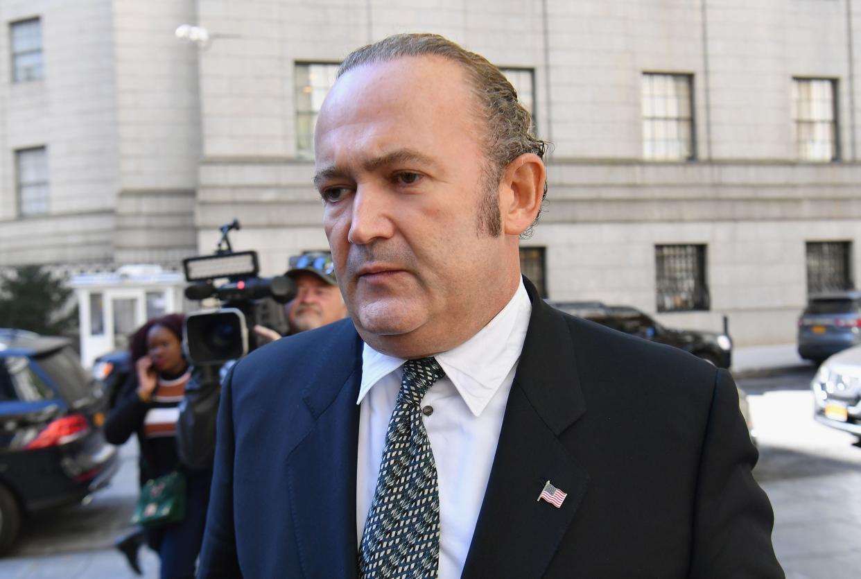 Photo shows Igor Fruman leaving Manhattan federal court in New York City after a criminal arraignment hearing on October 23, 2019. (Photo by Angela Weiss / AFP) (Photo by ANGELA WEISS/AFP via Getty Images) ORIG FILE ID: AFP_1LO3Z3