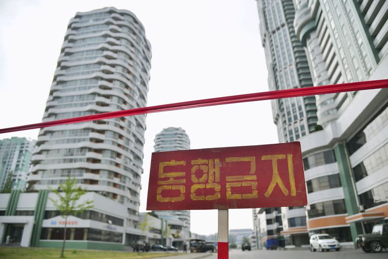 Sign is seen on closed street amid fears over COVID-19, in Pyongyang