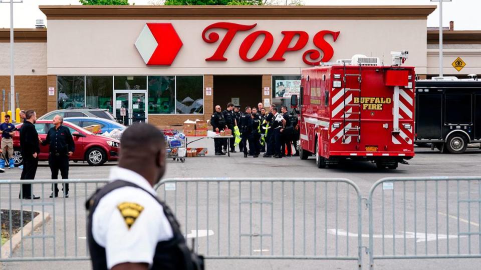 Investigators work the scene of a shooting at a supermarket, in Buffalo, N.Y., Monday, May 16, 2022. While law enforcement officials have grown adept since the Sept. 11 attacks at disrupting well-organized plots, they face a much tougher challenge in intercepting self-radicalized young men who absorb racist screeds on social media and plot violence on their own. (AP Photo/Matt Rourke)