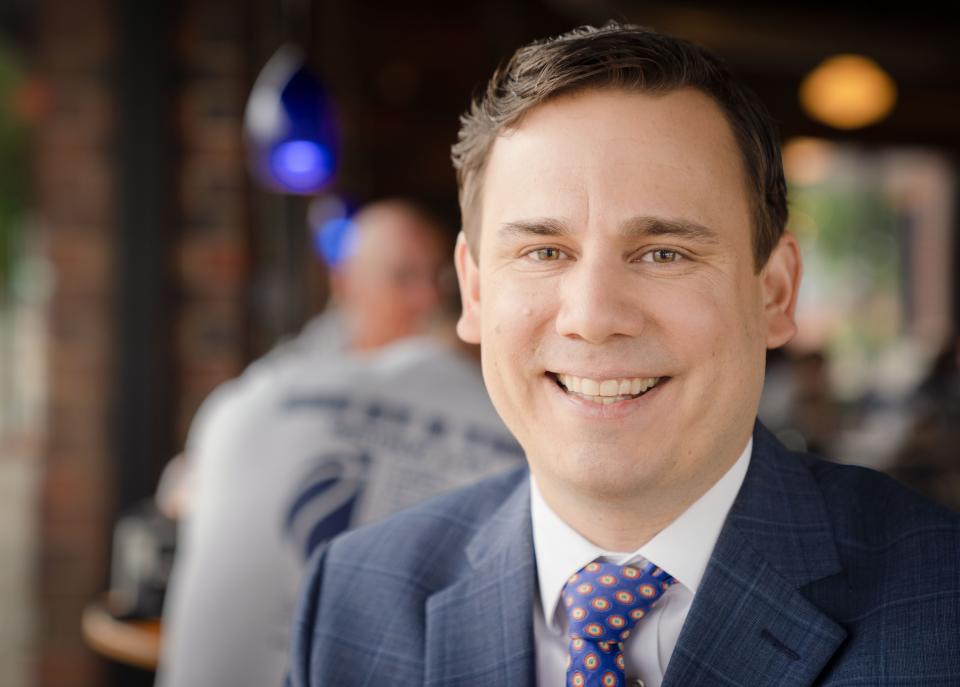 Former KCCI chief meteorologist Chris Gloninger sits for a photo at a coffee shop in Des Moines.