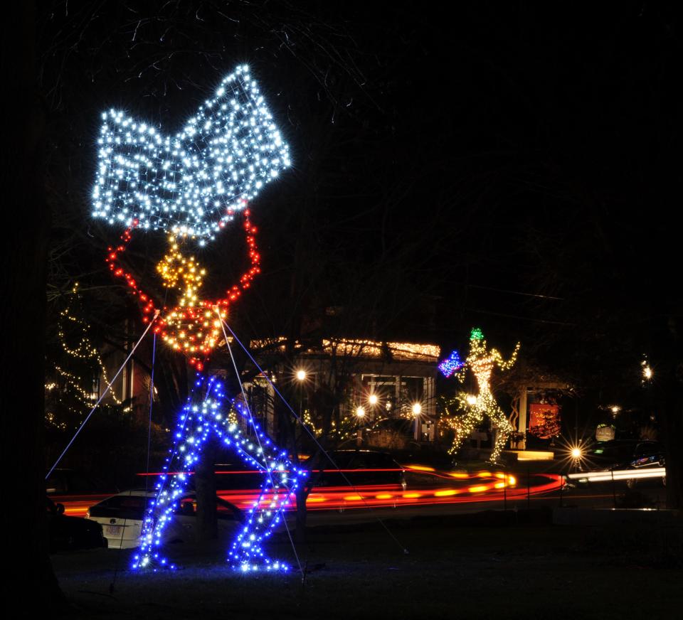 Light Giants was created by Michael Magyar in Sandwich center for the 2014 holiday season. This one is in front of the library with the Daniel Webster Inn in the background.