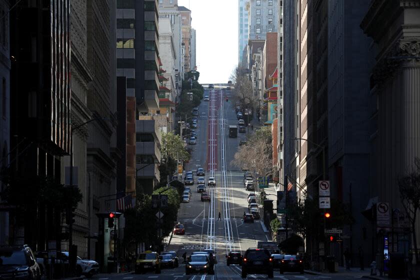 SAN FRANCISCO, CA - FEBRUARY 10: The San Francisco cable car system is not operating along California Street in downtown on Wednesday, Feb. 10, 2021 in San Francisco, CA. San Francisco rents have gone down during the COVID-19 pandemic that tenants in East Bay communities - Oakland, Berkeley, etc. - are moving to San Francisco because it's more affordable. (Gary Coronado / Los Angeles Times)