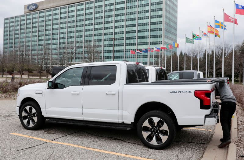 FILE PHOTO: A model of the all-new Ford F-150 Lightning electric pickup is parked in front of the Ford Motor Company World Headquarters in Dearborn