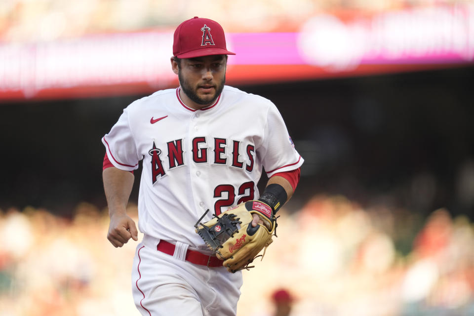 Los Angeles Angels shortstop David Fletcher (22) runs to the dugout in the middle of the first inning of a baseball game against the Arizona Diamondbacks in Anaheim, Calif., Friday, June 30, 2023. (AP Photo/Ashley Landis)