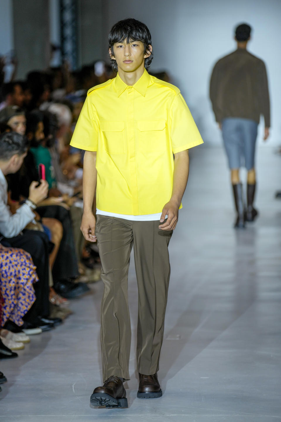 A model wears a creation as part of the Neil Barret men's Spring Summer 2024 collection presented in Milan, Italy, Saturday, June 17, 2023. (AP Photo/Antonio Calanni)