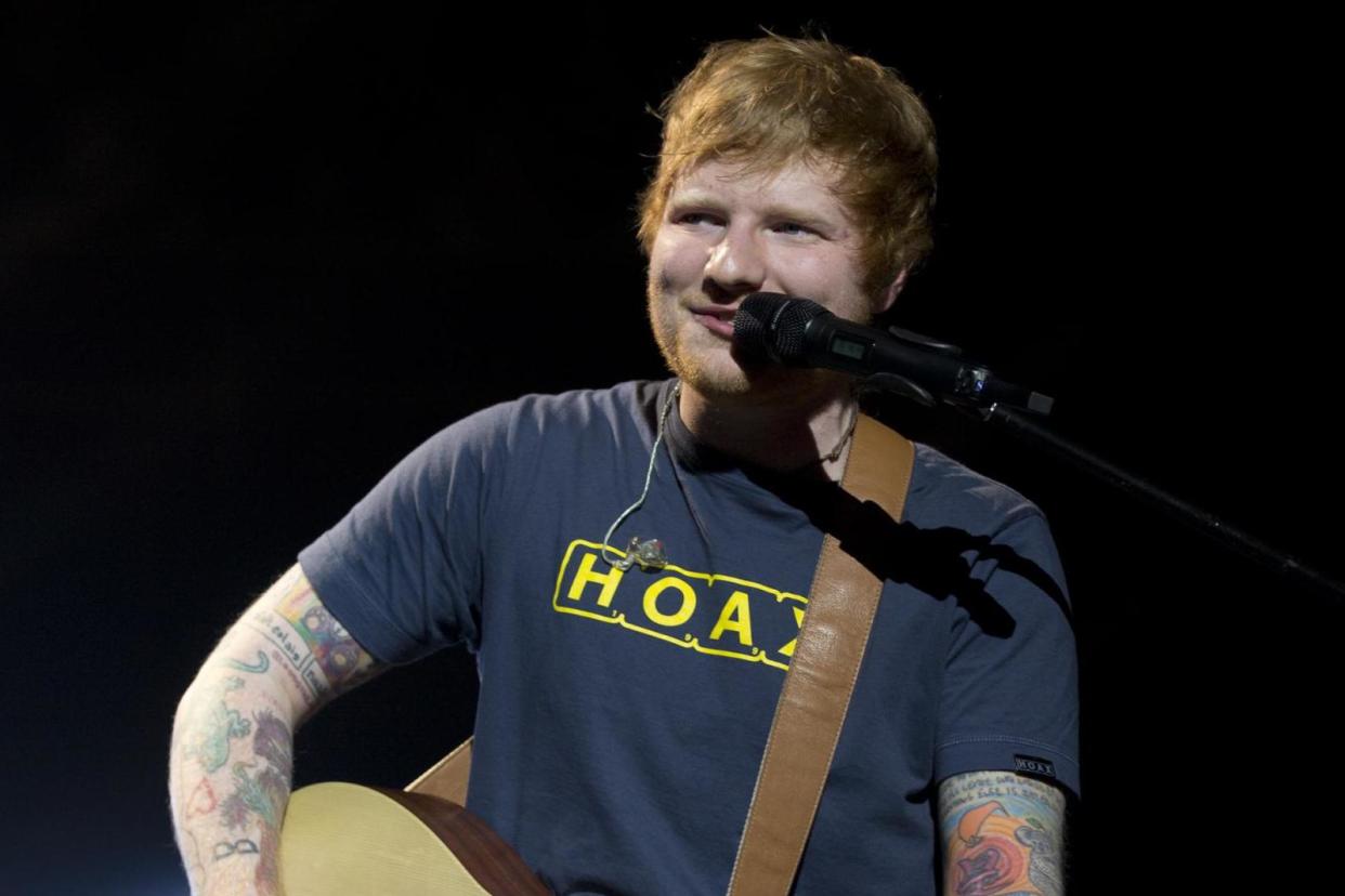 Low-key: Sheeran performed at the Royal Albert Hall with just a guitar, loop pedal and voice: PA Wire